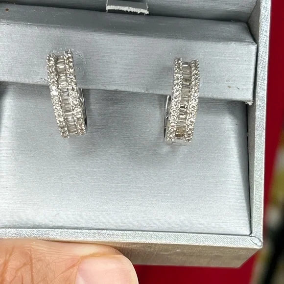Diamond hoops in white gold.